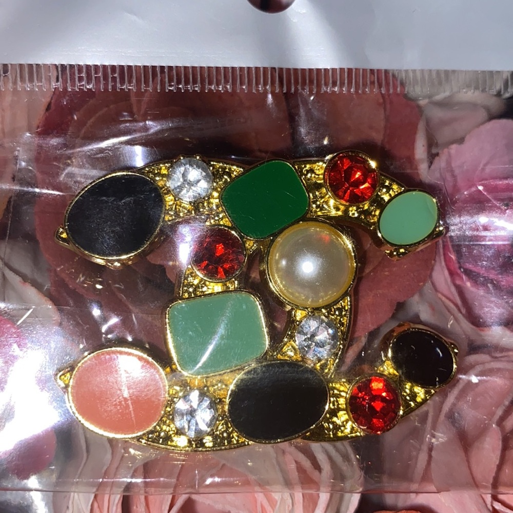 Cc brooch